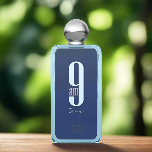 9AM Dive Perfume 100ml by Afnan, set against a tranquil beach, reflecting its fresh and aquatic vibe.