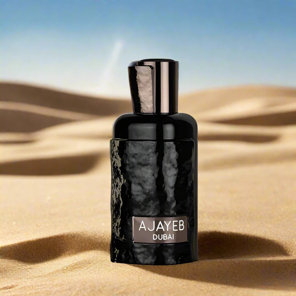 A luxurious perfume bottle of Ajayeb Dubai 100ml EDP by Lattafa, featuring an elegant design with intricate golden accents, placed against a serene desert-inspired background.