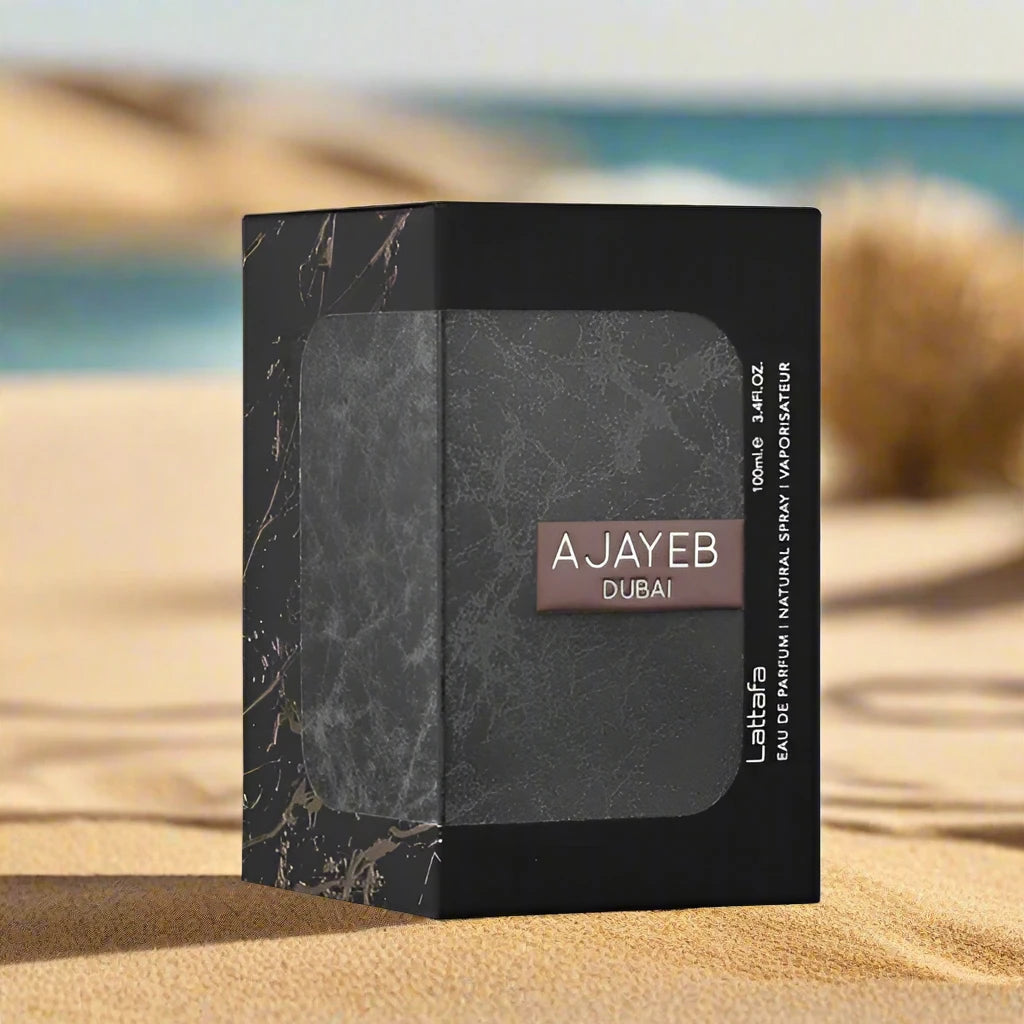 A luxurious perfume bottle of Ajayeb Dubai 100ml EDP by Lattafa, featuring an elegant design with intricate golden accents, placed against a serene desert-inspired background